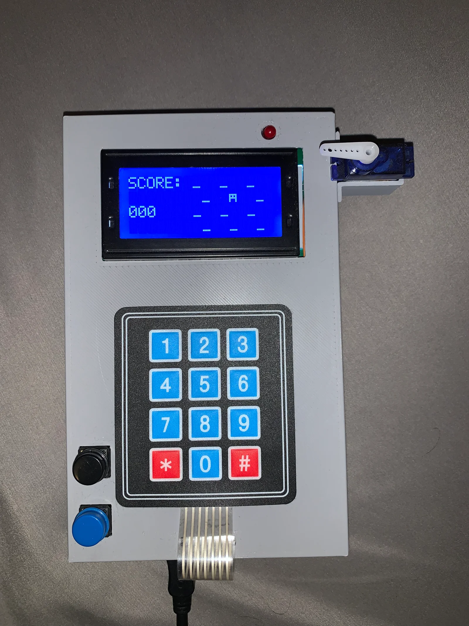 The LCD showing the current score and an active mole